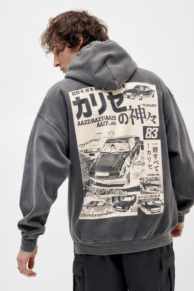Gray hoodie featuring a large graphic print on the back with vintage cars and Japanese text. Soft texture, oversized fit, and drawstring hood.