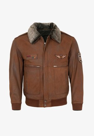 Braune Lederbomberjacke mit einem Kunstfellkragen, Reißverschluss, zwei Fronttaschen und gestickten Patches auf der Brust und dem Ärmel.
