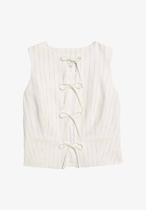 Biała bezrękawnikowa bluzka w pionowe prążki, z zapięciem na guziki ozdobionym cienkimi sznurkami oraz dwiema przednimi kieszeniami. Gładka tekstura.