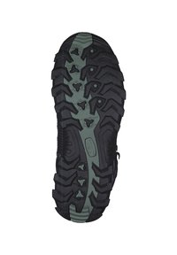 Sole di sneaker nera con scanalature profonde e aggressive. Presenta una combinazione di colori verde e nero, modelli testurizzati e un design imbottito.