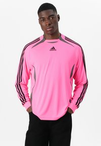 Long-sleeve athletic shirt in bright pink with gray accents. Features black side stripes and an Adidas logo on the chest.