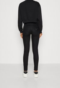 Guess Vaqueros pitillo - black denim