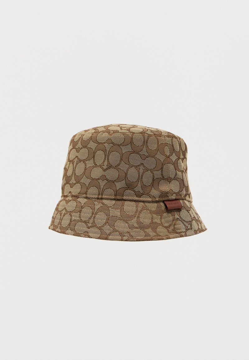 Brown bucket hat featuring a geometric pattern, soft textured fabric, wide brim, and a small logo tag on the side.