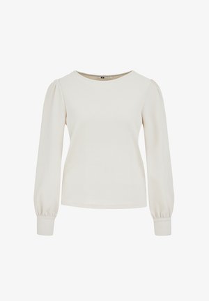 Blusa crema a maniche lunghe con texture, spalle imbottite e polsini aderenti, scollo rotondo, progettata per donne.