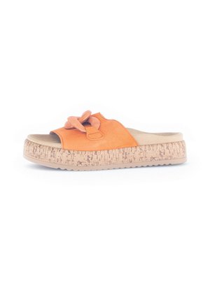 Orange suede slide sandal with floral accent, cork-textured midsole, and a beige footbed. Flat, open-toed design with a textured outsole.