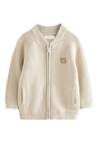 Beige zip-up cardigan in textured knit. Features a bear graphic on the chest, ribbed cuffs, and two side pockets. Suitable for layering.