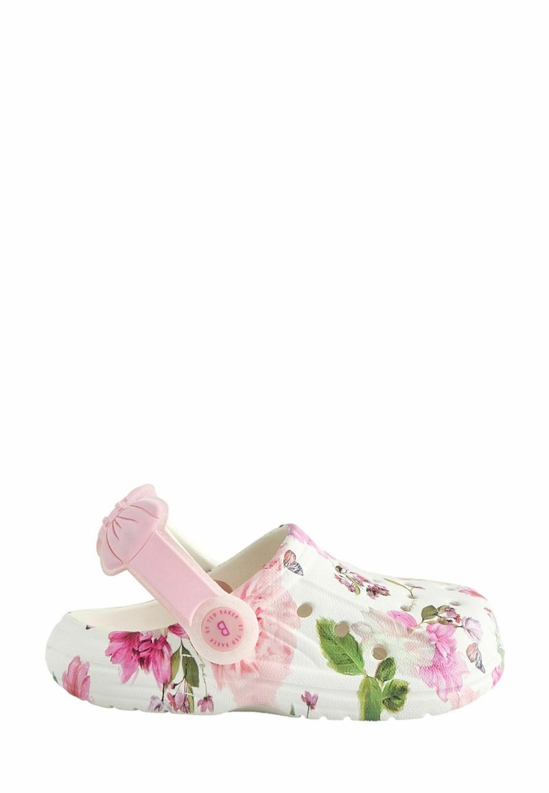 Zoccoli con motivo floreale in bianco e rosa, dotati di una fascia rosa regolabile con dettaglio a fiocco. Realizzati in materiale flessibile con fori di ventilazione.