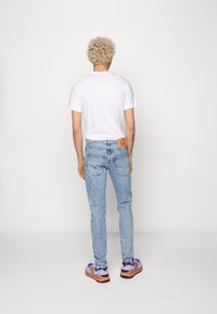 Levi's® 512™ SLIM TAPER LOW BALL - Calças de ganga justas - wolf horizon