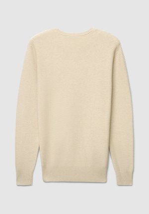 Pull de couleur crème avec un motif côtelé texturé, col rond et manches longues. Présente une coupe droite ainsi que des poignets et un ourlet côtelés.