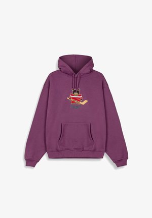 Lila Kapuzenpulli mit Kängurutasche, Zugkordel und gesticktem Bärenmotiv, der einen Hockeyschläger hält. Weicher, strukturierter Stoff.