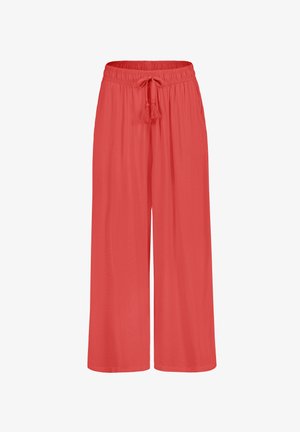 Loose-fitting, coral-colored palazzo pants with an elastic waistband and drawstring, featuring a soft, smooth texture and wide-leg design.