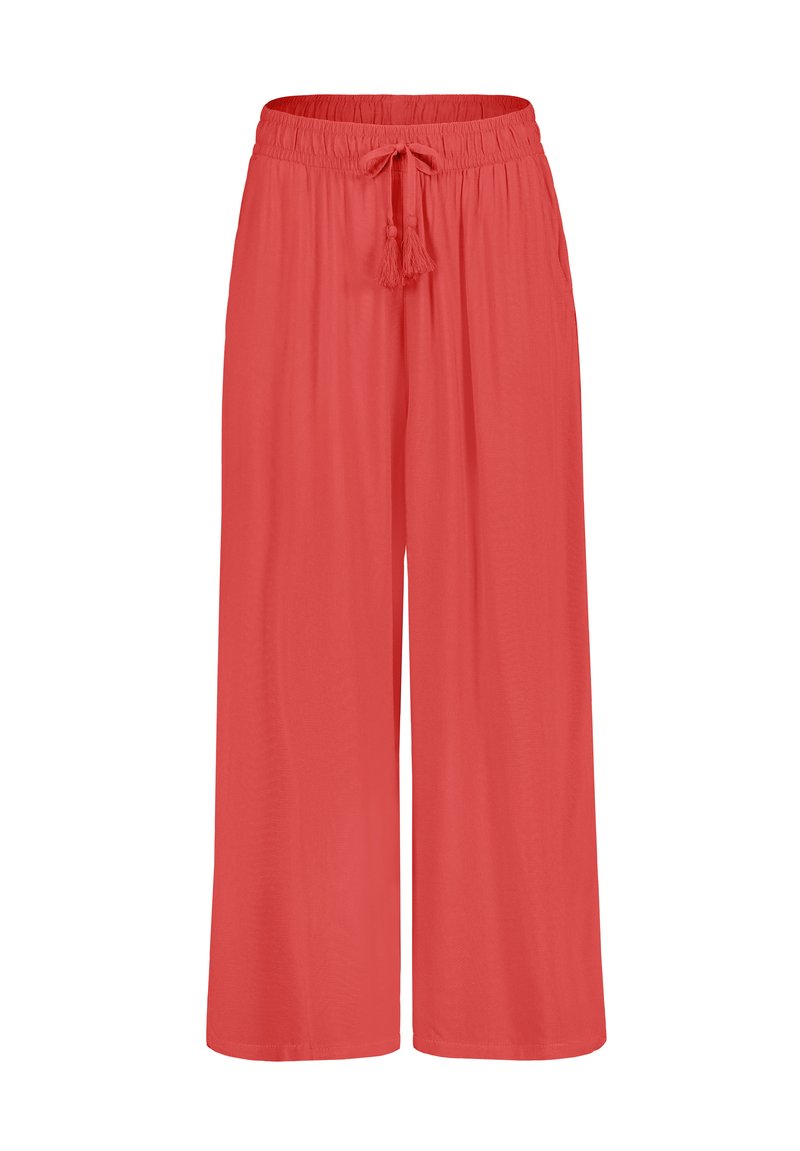 Loose-fitting, coral-colored palazzo pants with an elastic waistband and drawstring, featuring a soft, smooth texture and wide-leg design.