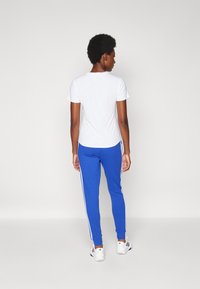adidas Sportswear Treniņtērpa apakšdaļas - semi lucid blue