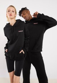YOURTURN by Zalando - UNISEX - Hoodie - true black Thumbnail Image 1