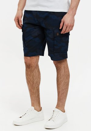 Marine camouflage cargo shorts med en afslappet pasform, lavet af et struktureret stof. Har sidelommer og detaljer med knaplukning.