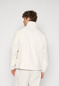 Puma KIDSUPER RBS REVERSIBLE JACKET - Klubbklær - elektro blue/frosted ivory