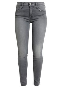 Jeans de denim gris con ajuste slim, diseño de cinco bolsillos y cierre de botón metálico. Presentan un ligero desvanecimiento a lo largo de las piernas y una textura suave.