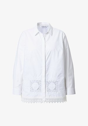Hvid bomulds skjorte med knapper, der har broderede lace detaljer ved bundkanten, med krave og lange ærmer.