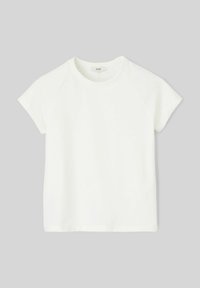 T-shirt en coton blanc avec des manches raglan courtes, col rond et une texture lisse. Design simple sans motifs ni accents.
