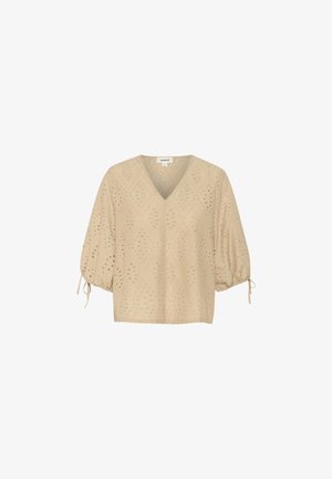 Beige V-Ausschnitt-Bluse mit kurzen Ballonärmeln, die mit Rautenmuster und ausgeschnittenen Details versehen ist. Das Material ist leicht und strukturiert.