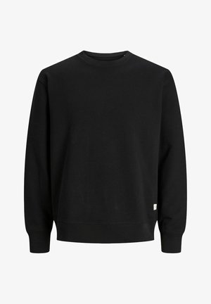 Juodas džemperis, pagamintas iš minkštos medžiagos. Turi apvalų iškirpimą, ilgomis rankovėmis ir nertais rankogaliais. Minimalistinis dizainas be matomų raštų.