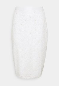 Jupe crayon blanche en tissu texturé avec un motif de points en relief, dotée d'une ceinture lisse et d'un design à longueur de genou. Ajustement doux et structuré.
