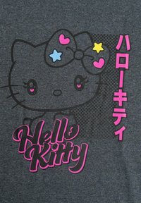 Gray t-shirt featuring a black Hello Kitty graphic with a pink bow, pink and blue stars, and bright pink "Hello Kitty" text.