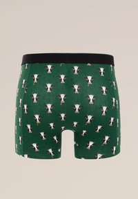 Zeleni boksarice z večkratnim vzorcem kravjih obrazov, črnim elastičnim pasom, izdelane iz mehkega razteznega blaga.
