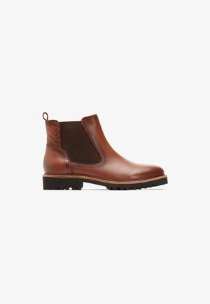 Brown leather Chelsea boot featuring a textured elastic side panel, a pull tab at the back, and a rugged black sole with traction.