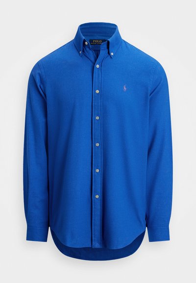 Royal blue button-up shirt made of soft fabric, featuring a classic collar, long sleeves, and a small embroidered logo on the chest.