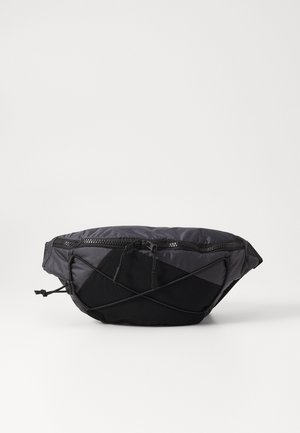 Black pouch bag with a smooth, shiny texture. Features a top zipper, crisscross straps, and a distinct wedge shape.