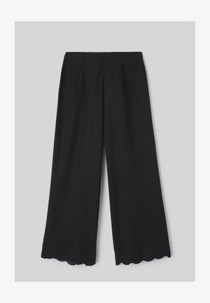 Pantalon noir à jambes larges avec ourlet festonné et détails floraux découpés brodés en bas.