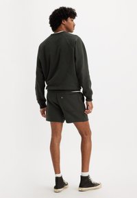 Levi's® PRIDE GRAPHIC UNISEX - Trainingsbroek - pirate black