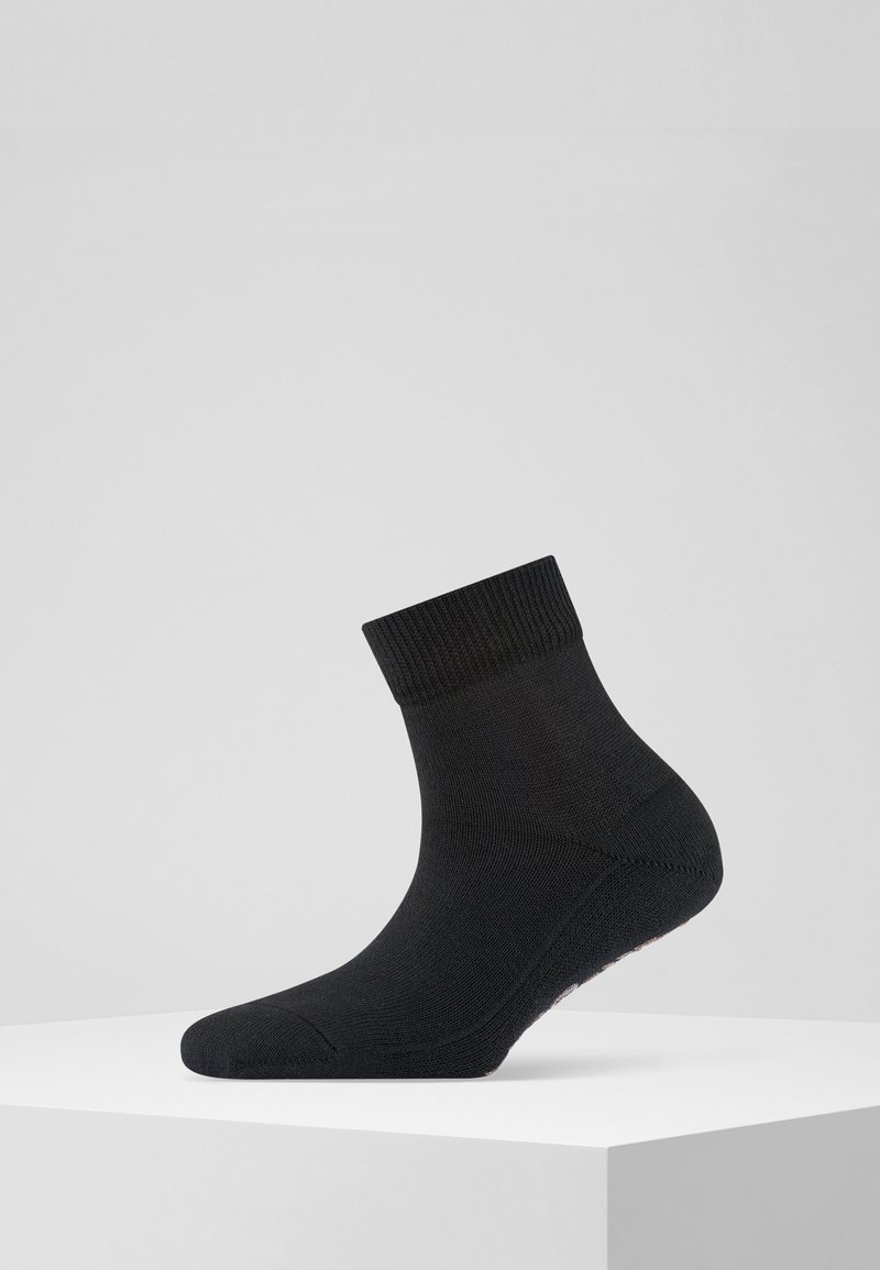 Calzino nero a mezza lunghezza con risvolto a coste, texture liscia, punta e tallone rinforzati. Realizzato in materiale elasticizzato per comfort e aderenza.