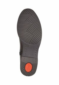 Semelle de chaussure en caoutchouc noir avec des motifs texturés et un accent circulaire rouge étiqueté "le confort de Jack". Bord lisse le long des côtés.