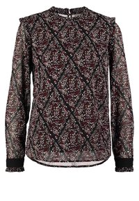 Blouse transparente à manches longues avec une base noire et un motif floral complexe en bordeaux et blanc, avec des poignets et un col volantés.