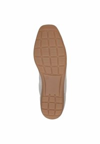 Semelle de chaussure avec une surface en caoutchouc texturé, présentant un motif en grille et une couleur beige, conçue pour l'adhérence et la durabilité.