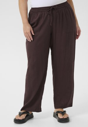 Maroon, lightweight, relaxed-fit pants with an elastic waistband, drawstring detail, and side pockets, paired with black sandals.
