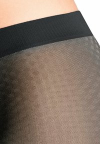 Collants transparents avec une taille texturée noire. La partie jambe présente un motif dégradé du marron foncé au marron clair, créant une transition en douceur.