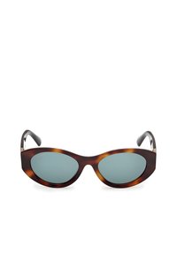 Gafas de sol en forma de ojo de gato de carey con lentes de tono azul y puntas de patilla negras y estilizadas. Cuenta con finos acentos de metal en las bisagras.