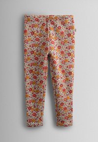 Cvečne legice z ivčno ozadje in rdečimi, oranžnimi in rumenimi cvetovi. Narejene iz mehkega blaga z oprijetim krojem in elastičnim pasom.