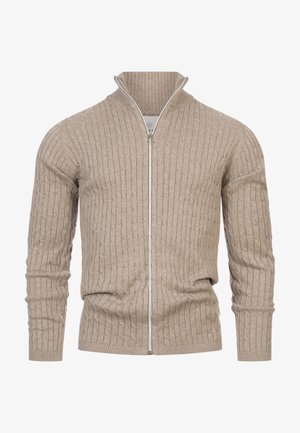 Beige-värinen, poimuttamalla kuvioitu vetoketjullinen neuletakki paksusta neuloksesta. Siinä on korkeakaulus ja vetoketjusuljenta, hienovaraisella tekstuurilla ja yksityiskohdilla.