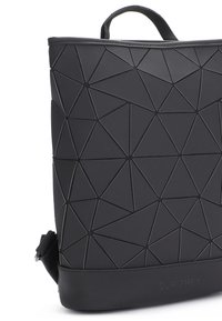 Black geometric backpack made of textured material, featuring a pattern of triangular shapes, top handle, and adjustable strap.