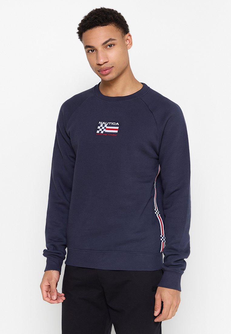 Nautica navy Sweatshirt mit geripptem Rundhalsausschnitt, Raglanärmeln, gesticktem Logo und gestreiften Akzenten an den Seiten. Mit Bündchen am Saum.