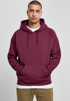 Bordeaux hoodie met een trekkoordkap, kangoeroezak en ribgebreide manchetten. Heeft een klassieke pasvorm met een zachte, textuurstof.