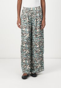 Pantaloni a gamba larga con un motivo floreale astratto nei toni crema, blu e marrone. Realizzati in tessuto leggero, con una vestibilità rilassata e cintura elastica.