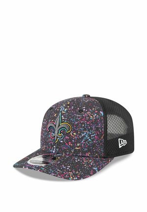Black cap with a splattered multicolor design. Features a yellow and green embroidered fleur-de-lis logo and mesh back panel.