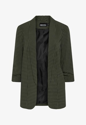 Blazer verde a motivo houndstooth con maniche a tre quarti, apertura frontale e una morbida fodera interna nera. Tessuto unico e testurizzato.