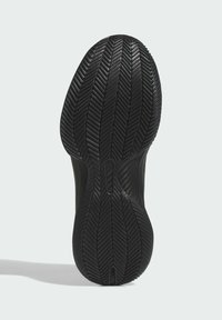 Semelle extérieure de chaussure de sport noire avec un motif de bande en herringbone. Texture lisse avec des bords contournés et une rainure centrale pour plus de flexibilité.