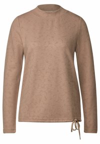 Langärmliges Oberteil in Beige mit strukturiertem Muster, mit hohem Kragen und seitlichem Bindeband für eine verstellbare Passform. Weicher Stoff und lässige Form.